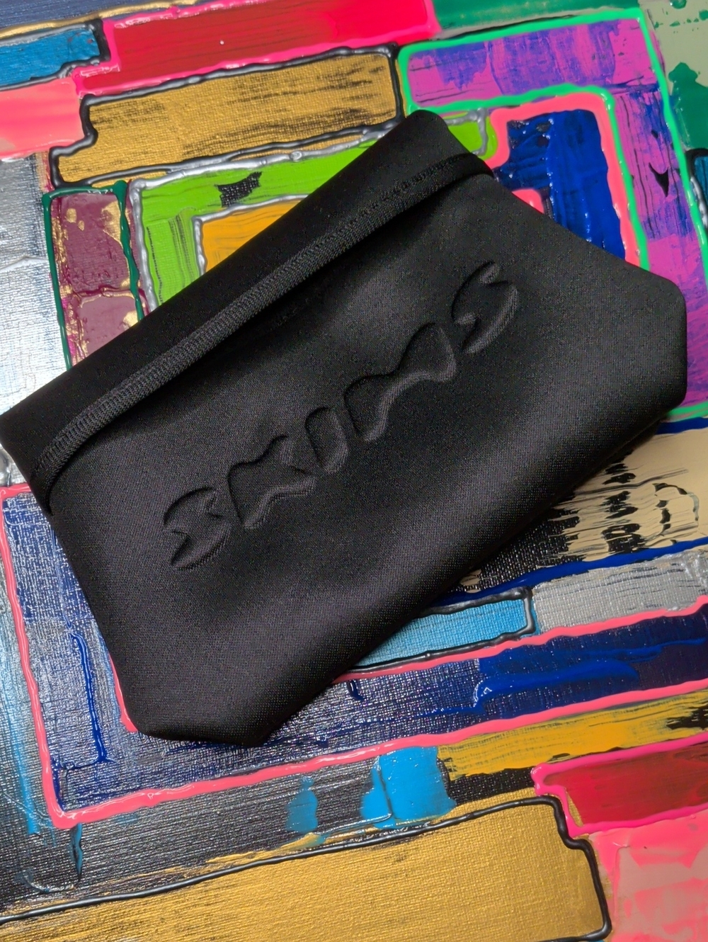 SKIMS Black Neoprene Cosmetic Pouch with Embossed Logo